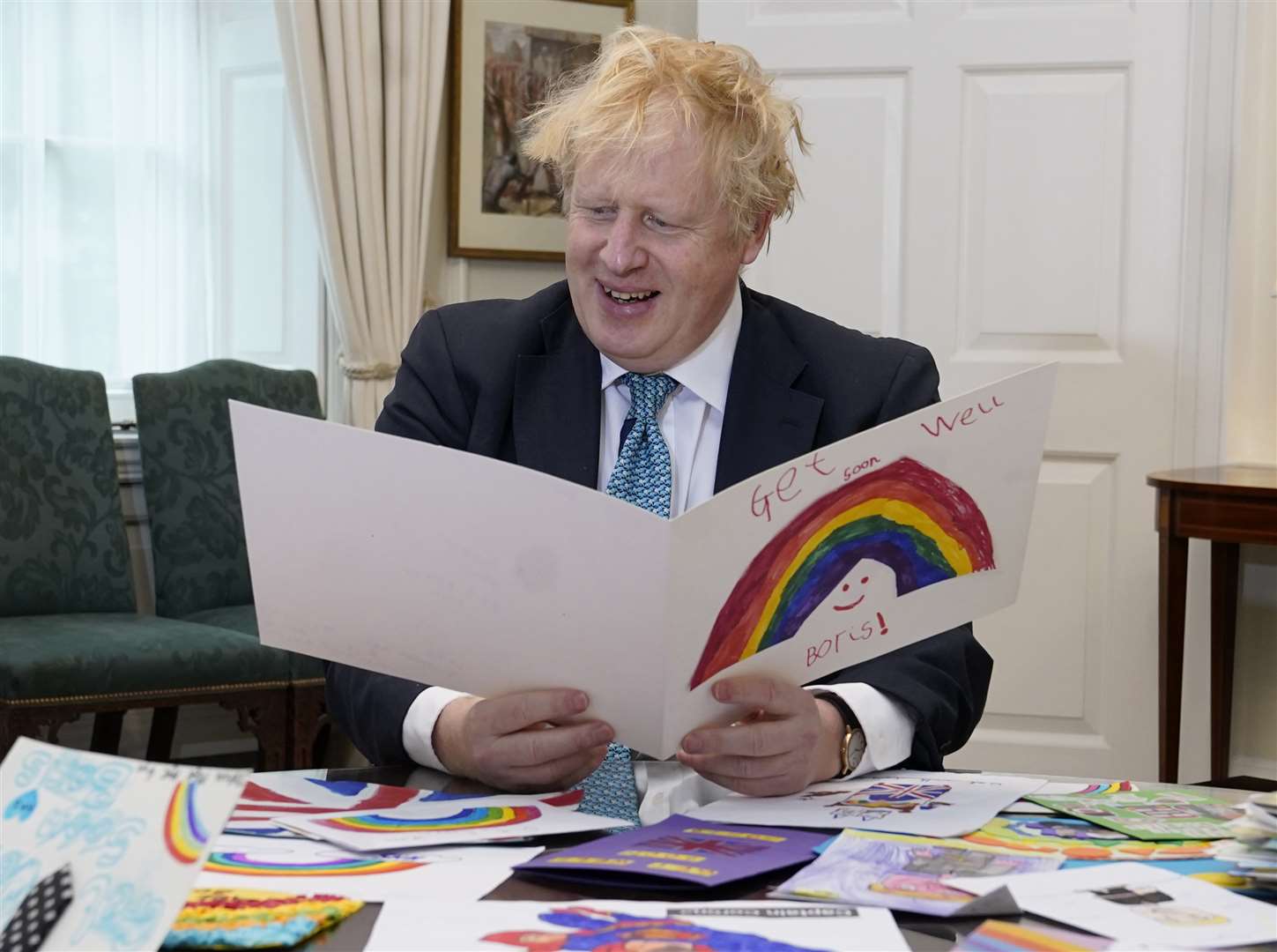 Boris Johnson looks through the messages (Andrew Parsons/10 Downing Street/Crown Copyright)