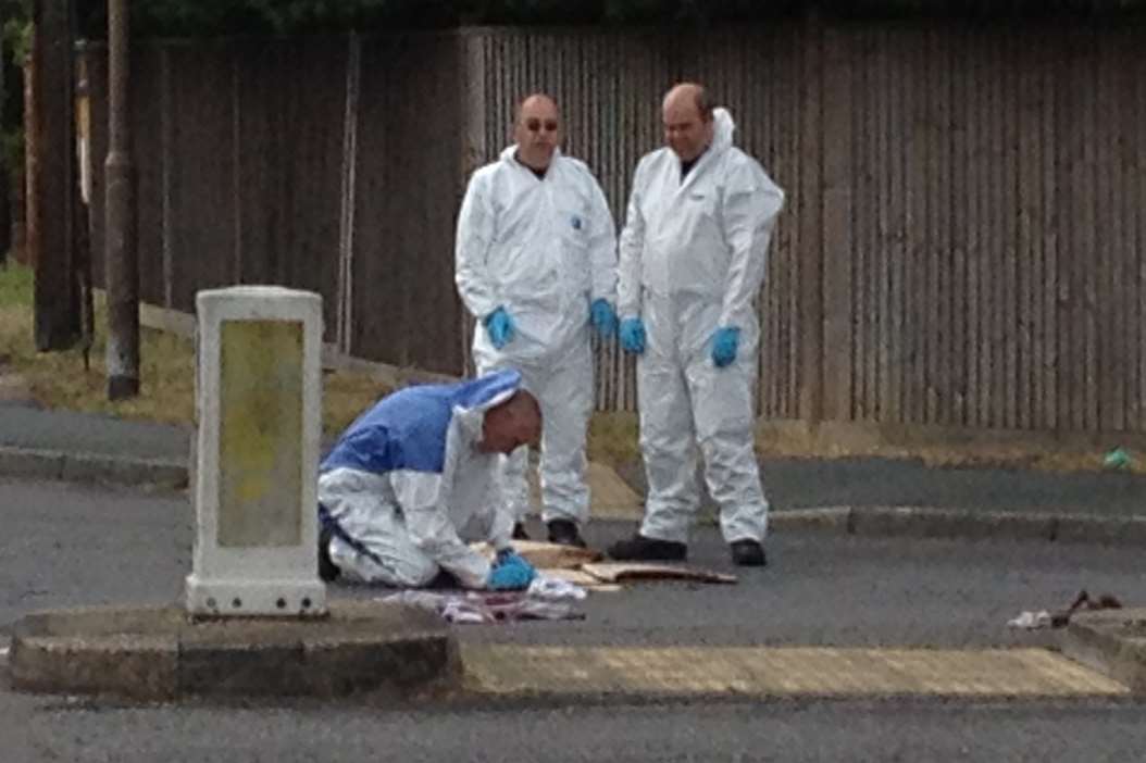 Forensics officers at the spot where Lekshmanan Asokkumar came off the fleeing car