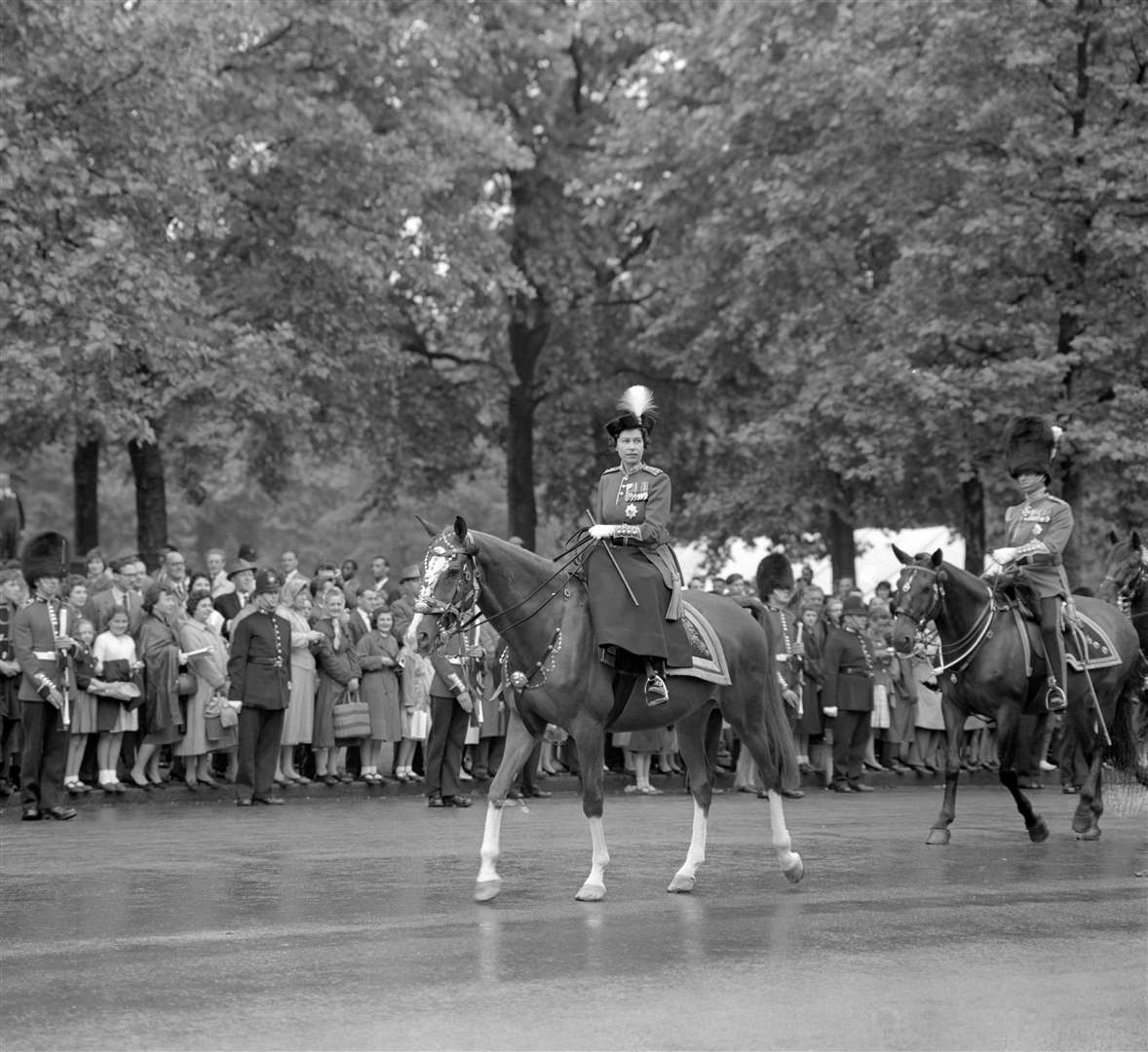 The Queen, riding her police horse Imperial, on The Mall during Trooping the Colour in June 1960 (PA)