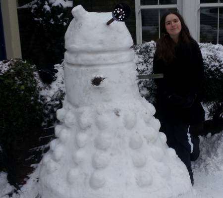 13-year-old Daisy Fry with her snow Dalek in Forbes Road, Faversham.