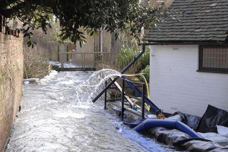 The swollen Nailbourne through Bridge. Picture: Chris Davey