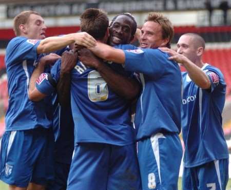 Gillingham players congratulate Garry Richards on his late winner last Saturday