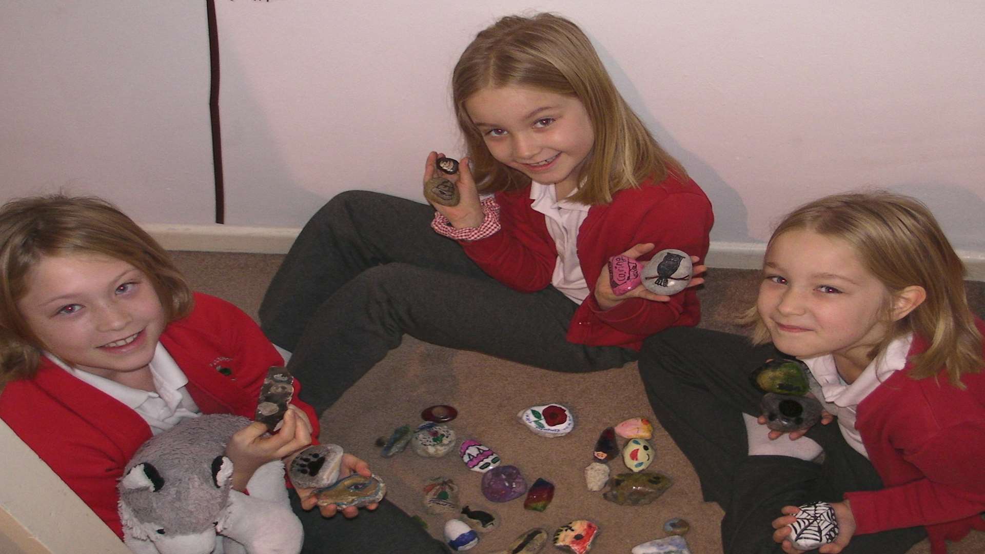 Jacqui Berry has got her daughters Ava, eight, left and Isla and Tegon, both six, into rock painting