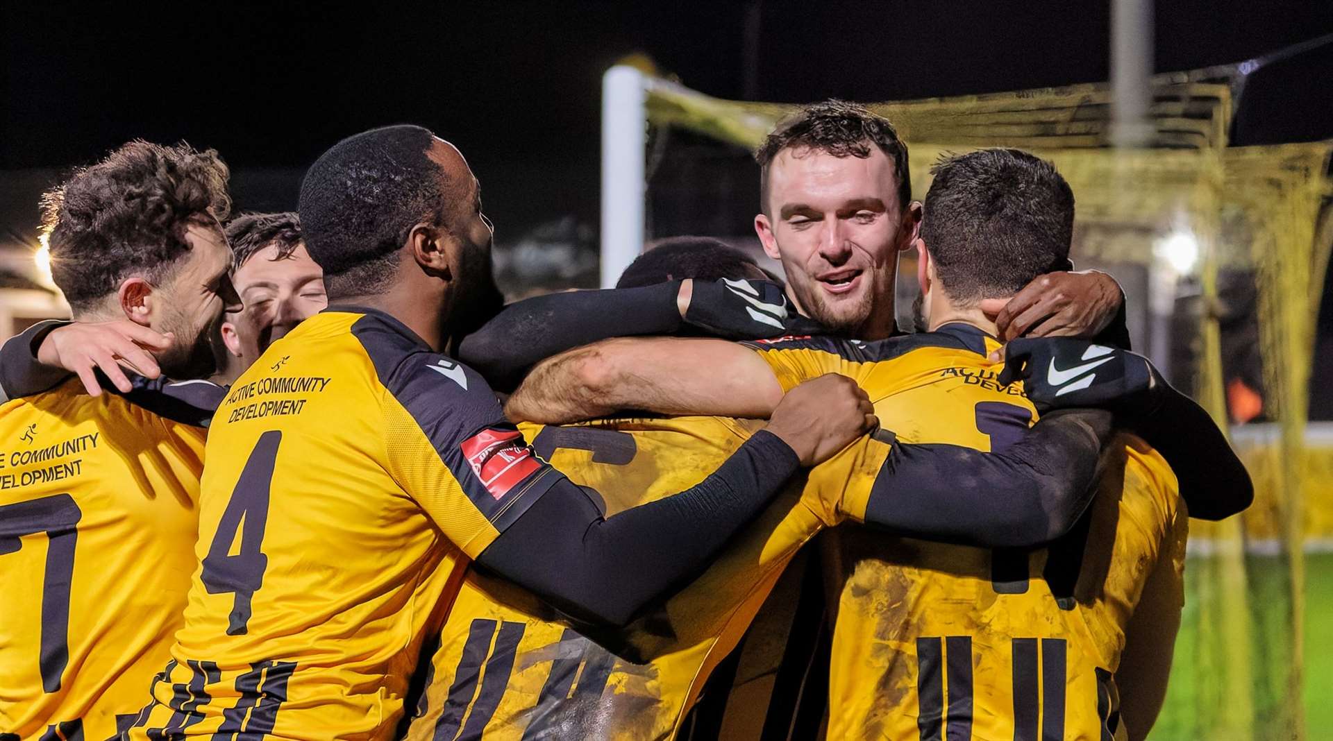 Folkestone celebrate one of midfielder Amadou Kassarate’s goals against Dulwich. Picture: Helen Cooper