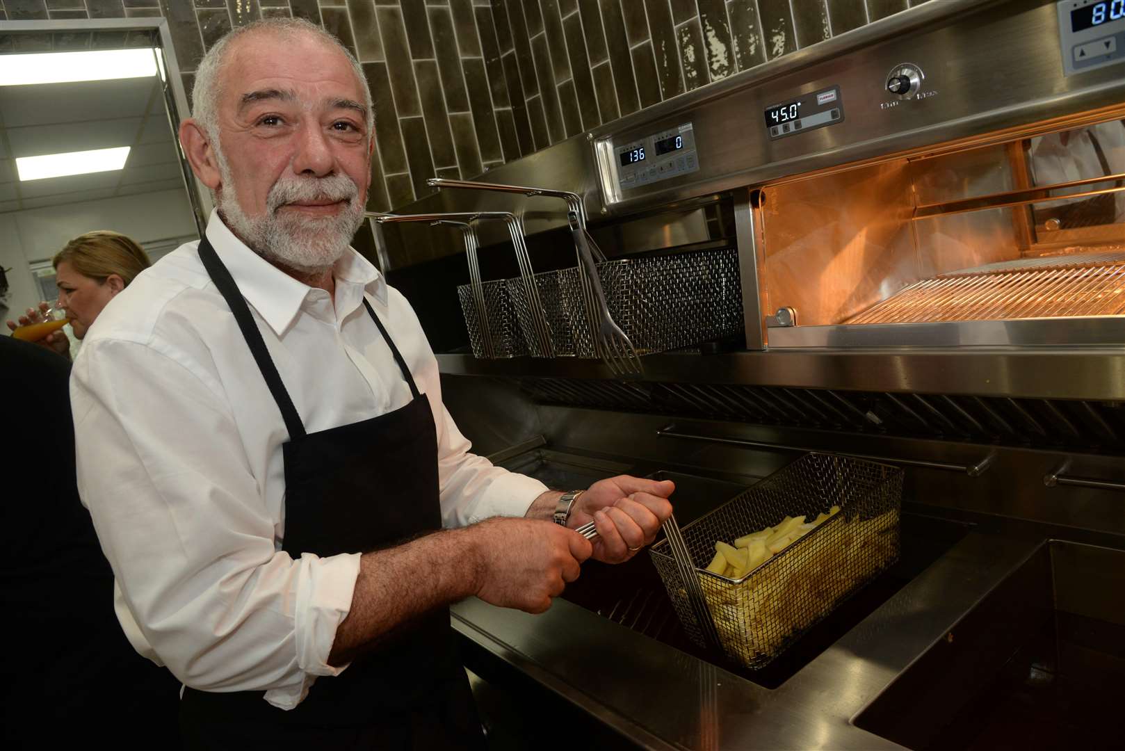 Back in business, Kikis Mathelu at Papa's fish and chip shop in Beatty Road, Rochester on Thursday. Picture: Chris Davey (2310641)