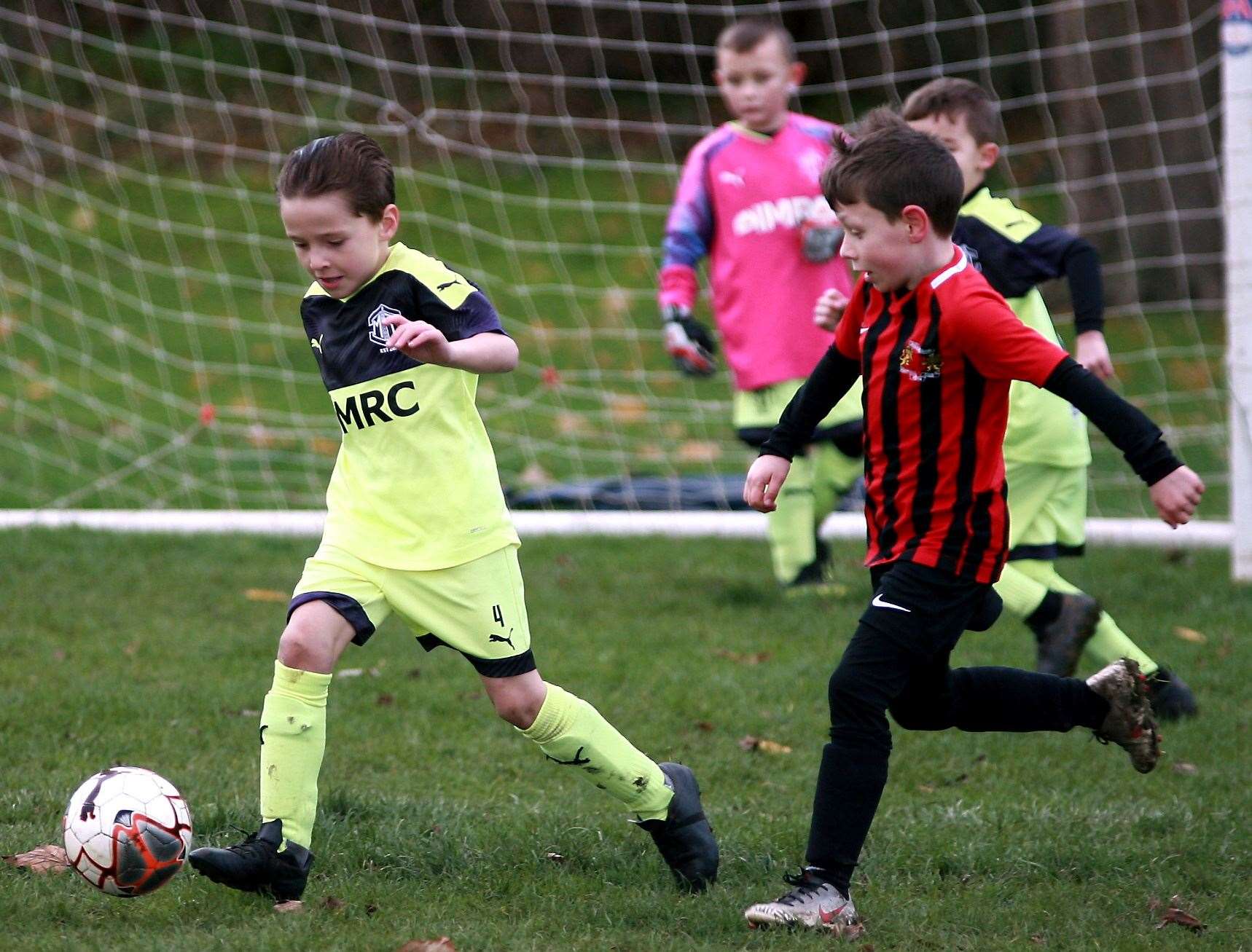 Medway Town under-7s on the ball against Woodcoombe Youth under-7s. Picture: Phil Lee FM23057027