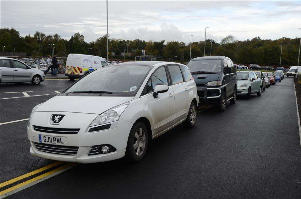 Cars parked along the entrance road John Lewis