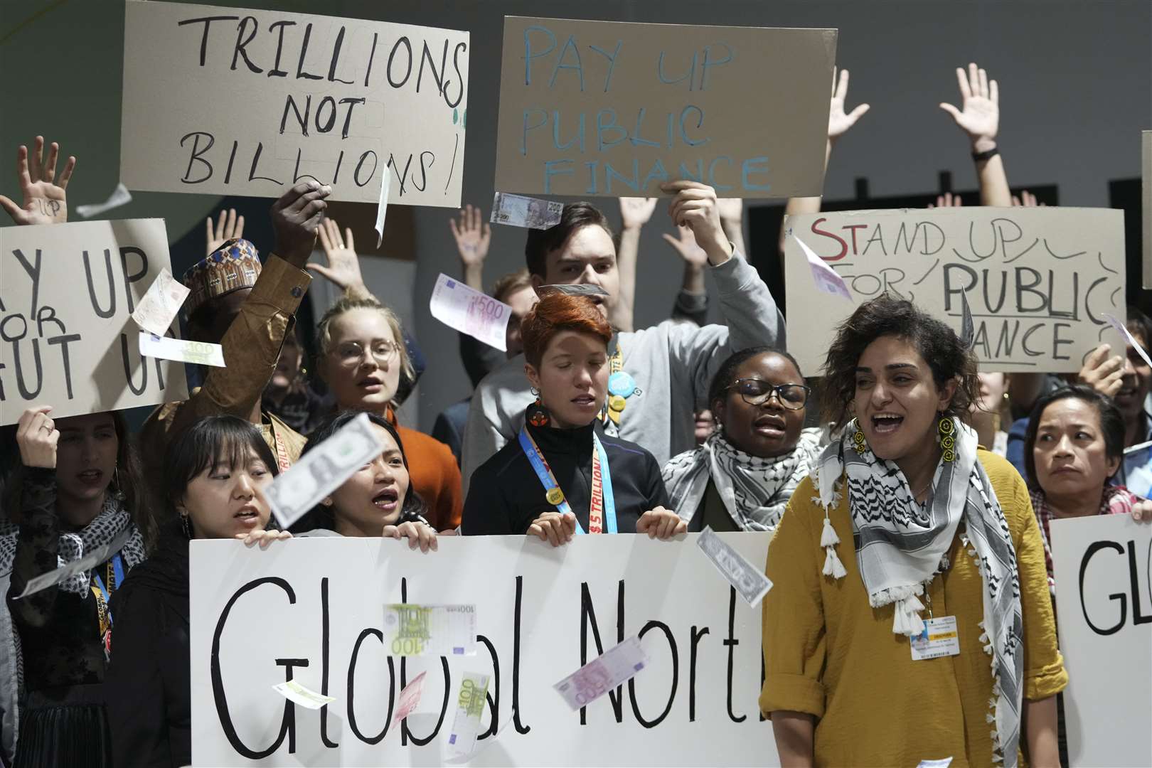 Activists participate in a demonstration for climate finance at the Cop 29 summit (Sergei Grits/AP)