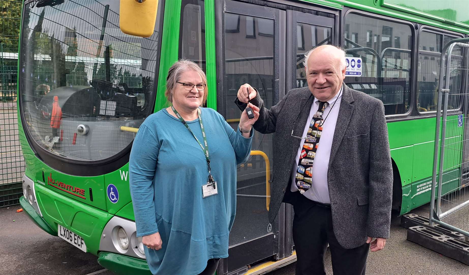 School principal Peggy Murphy accepted the keys to the bus from Norman Kemp in November