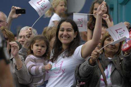 Young and old gather for the Olympic torch relay in Folkestone. Picture: Gary Browne