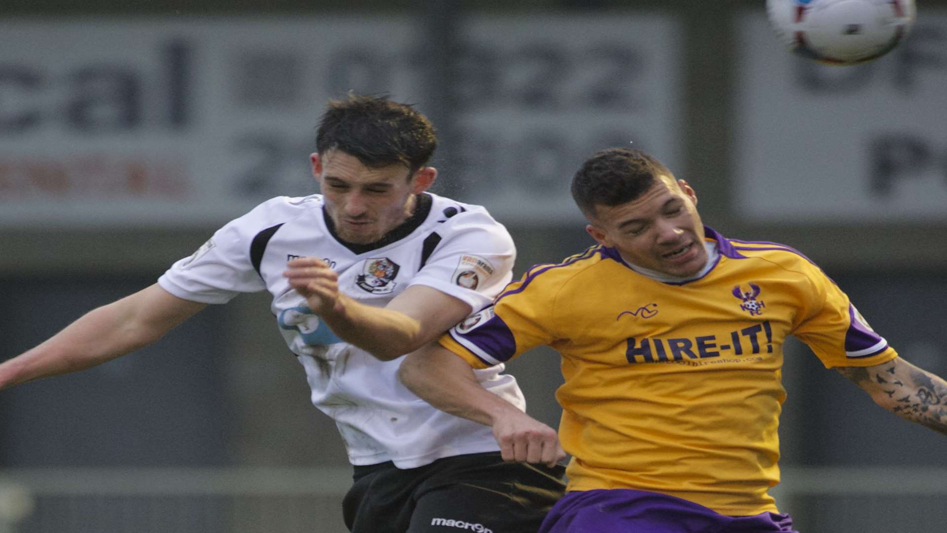 Callum Driver goes up for a header with Kidderminster's Marvin Johnson Picture: Andy Payton