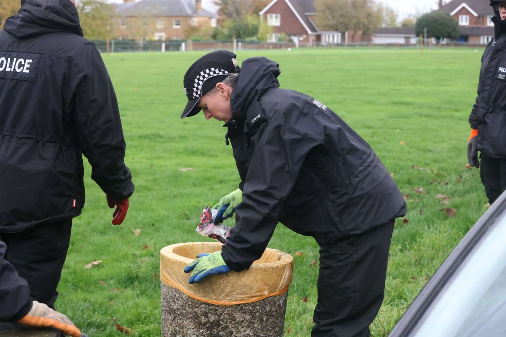 Police searching the historic green in Meopham opposite where a stabbing took place at the Cricketers pub