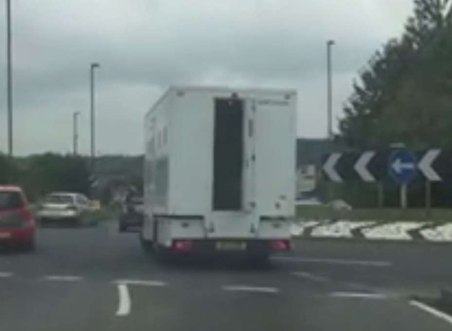 The Geo Amey prison van's back door swung open as the van was driven in Strood