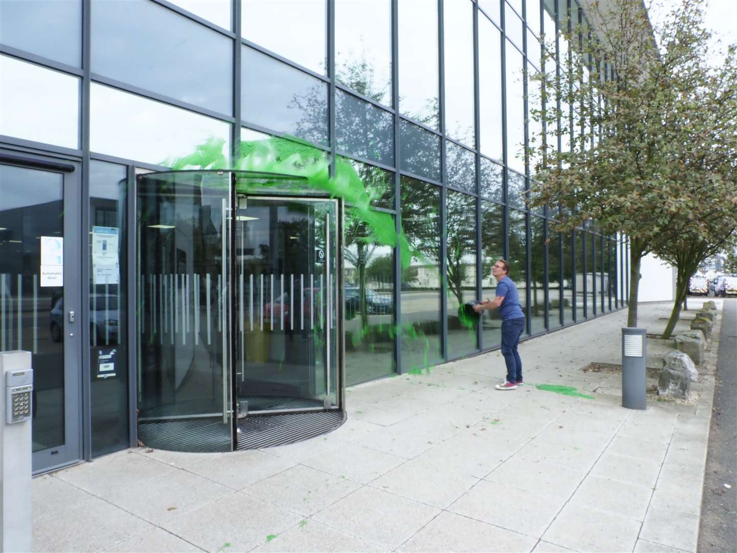 Protester Richard Eyre from Extinction Rebellion group Insurance Rebellion cover Lloyd's of London offices in green paint over company's support for fossil fuels. Picture: Richard Eyre