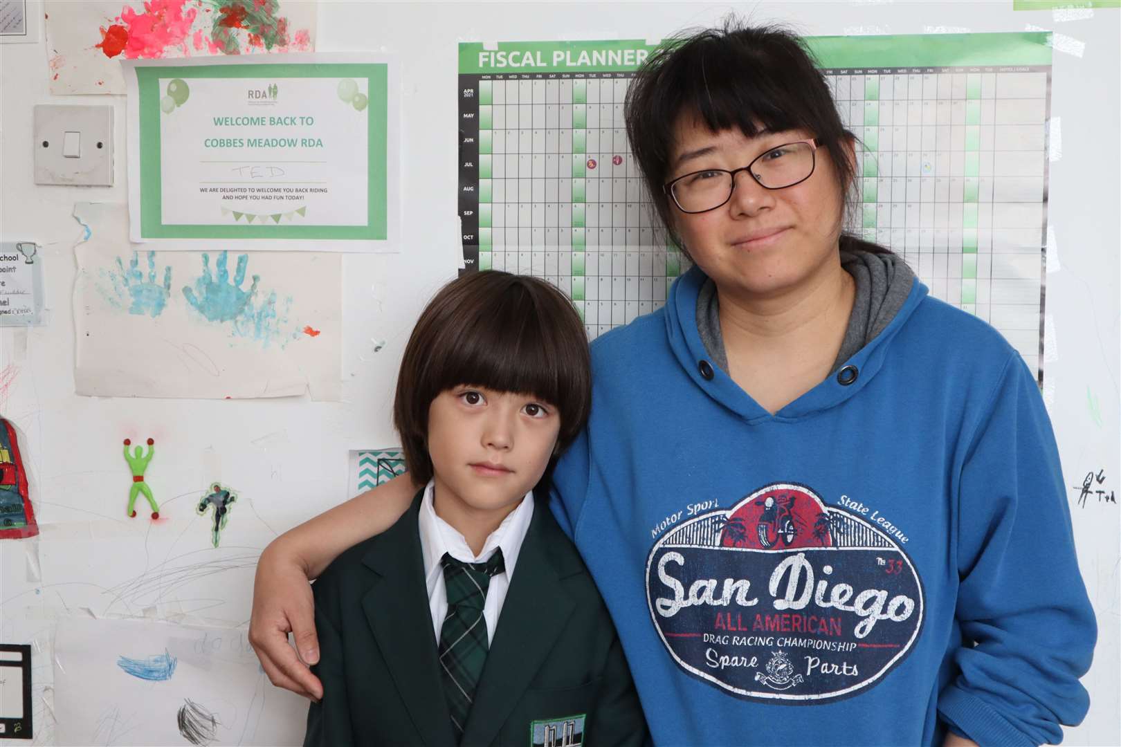 Mum Jie Tang and her son Ted, nine, after hearing Elliott Park private primary school in Marina Drive, Minster, Sheppey, had closed. Picture: John Nurden