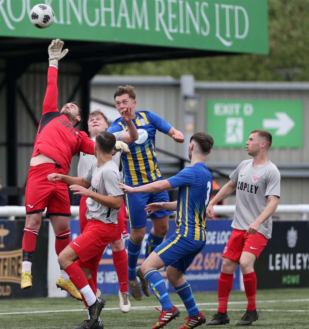 Goalmouth action from the DFDS Kent Intermediate Challenge Shield Final between Stansfeld O&B and Red Velvet. Picture: PSP Images