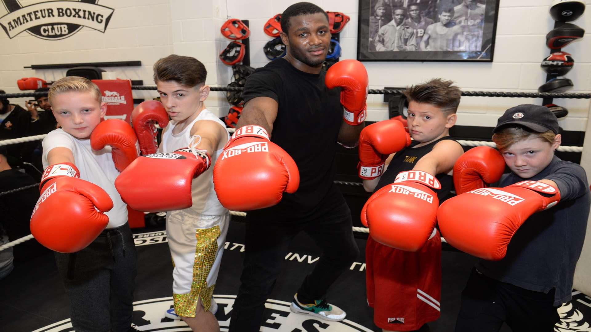 George Lindridge, 10, Jim Brazil, 12, Levi Brazil, 10, and Callum Plant, 10, with Chev Clarke