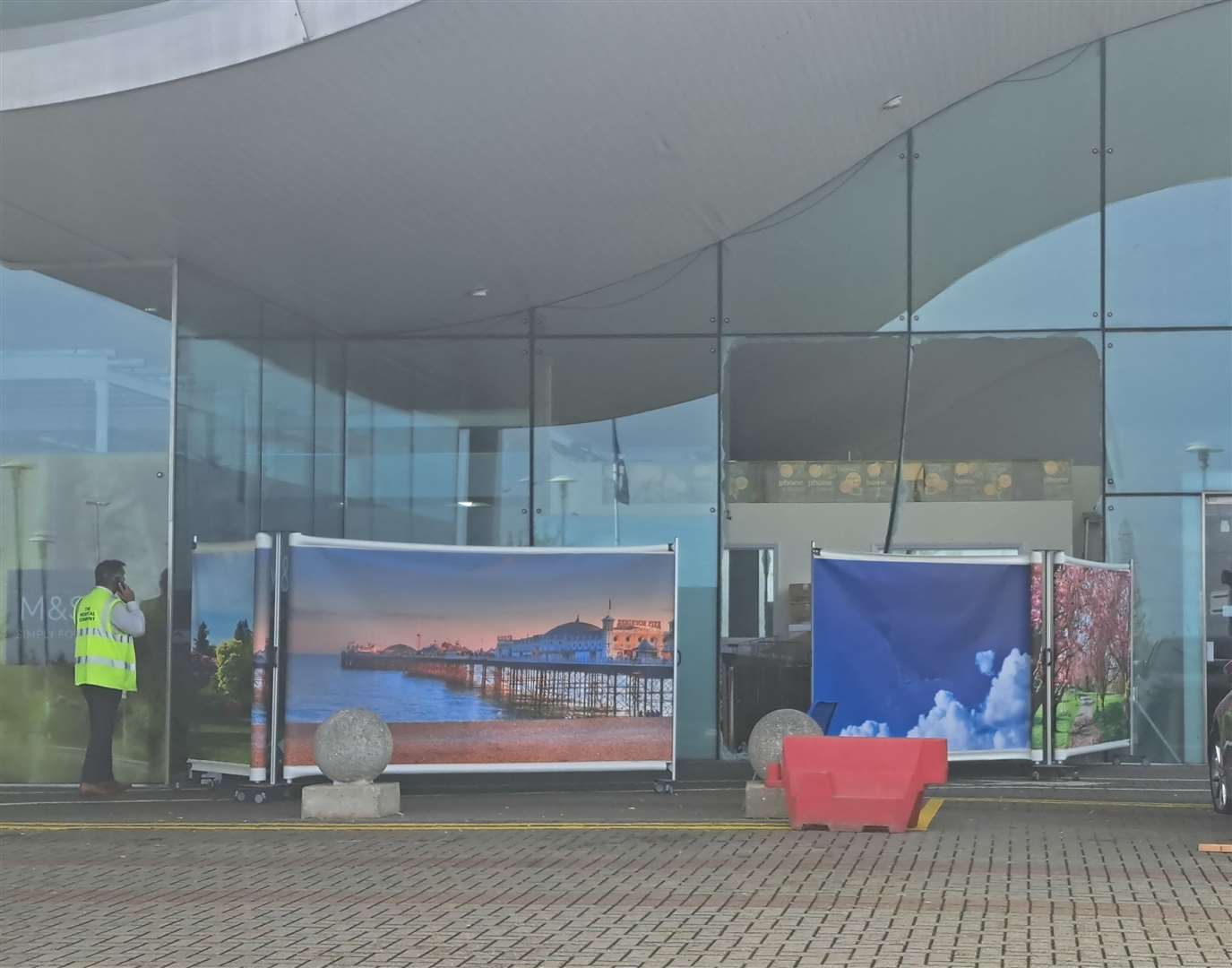 The area around the main entrance at Darent Valley Hospital has been cordoned off after a car smashed through the glass this morning