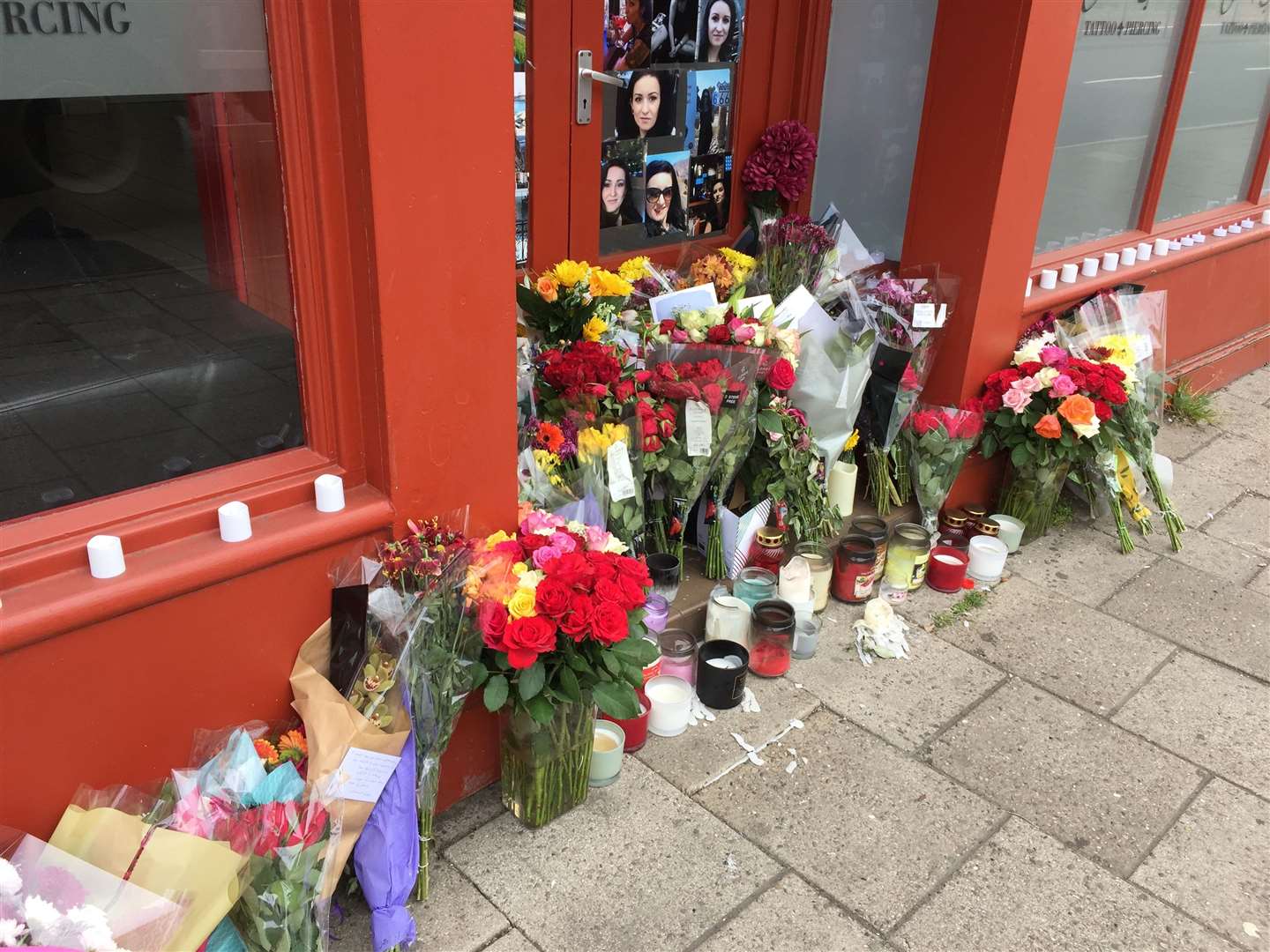 Tributes to Ramona Stoia, 35, outside the GothInk tattoo parlour in Canterbury