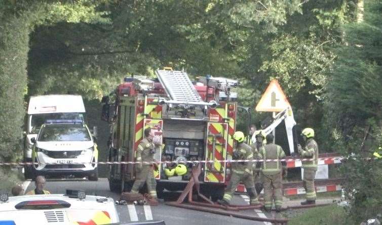 Firefighters at the scene after the tragic explosion in Charing