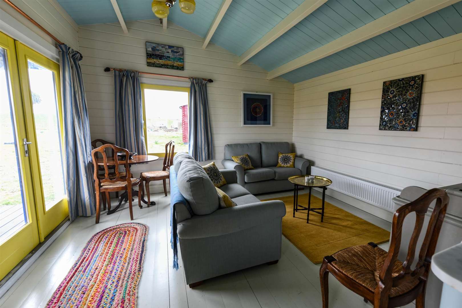 The lounge in the blue cabin with wall mosaics designed by Kimmie McHarrie. Picture: Phil Harris (5020379)