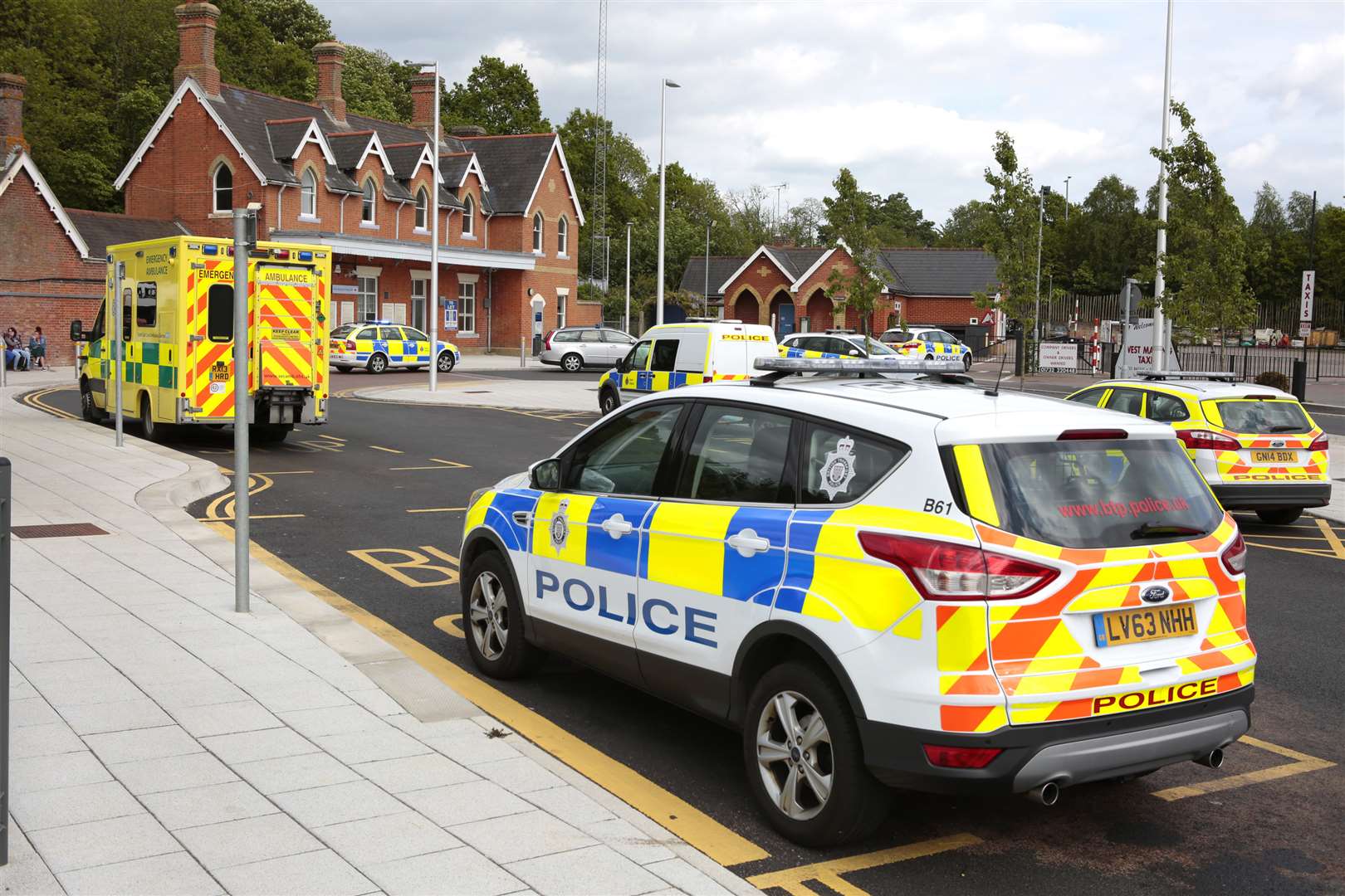 Police at West Malling Station on the day of Mr Cook's death