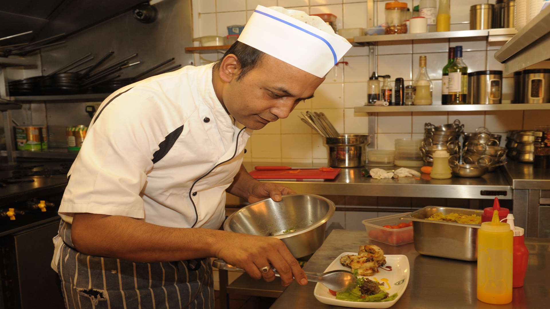 Abul Monsur serves up a dish at Taj Cuisine, Walderslade