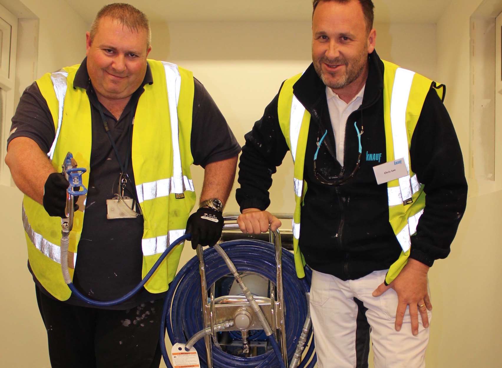 Action men Kevin Tarrant, left, and Chris Lee, training the trade how to use new airless crushed marble plaster