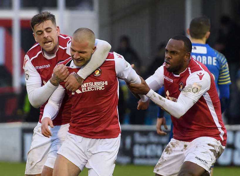 Luke Coulson celebrates his winner with Sam Magri and Myles Weston Picture: Andy Payton