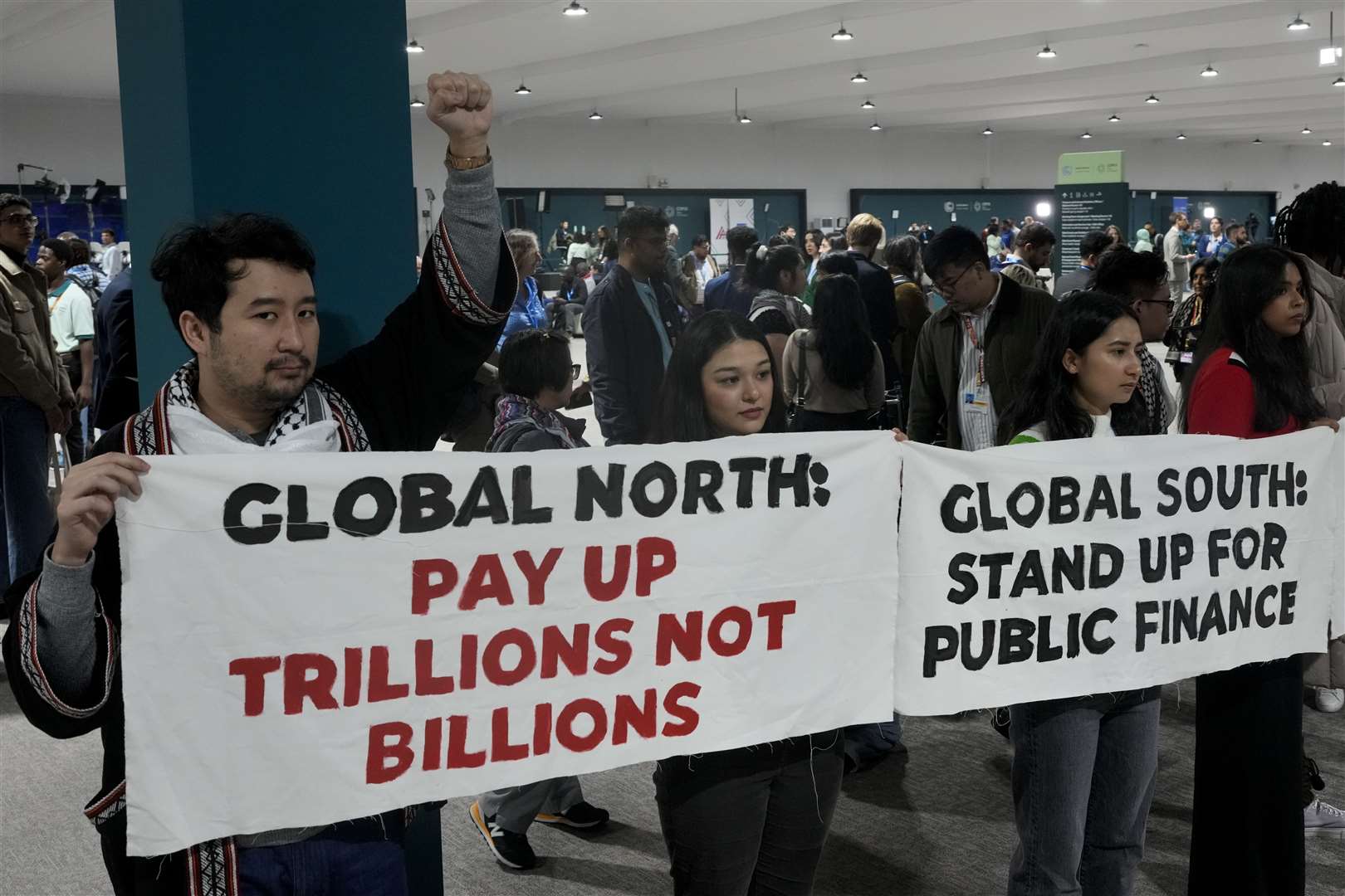 Activists demonstrate for climate finance at the Cop29 UN Climate Summit (AP Photo/Rafiq Maqbool)