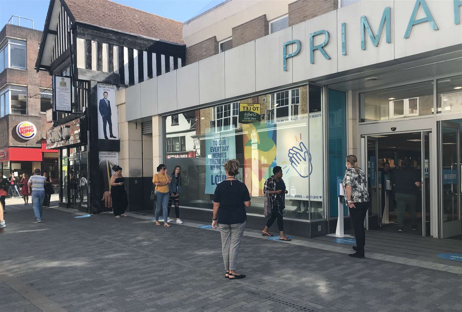 Customers queue outside Primark in Maidstone's Week Street this morning