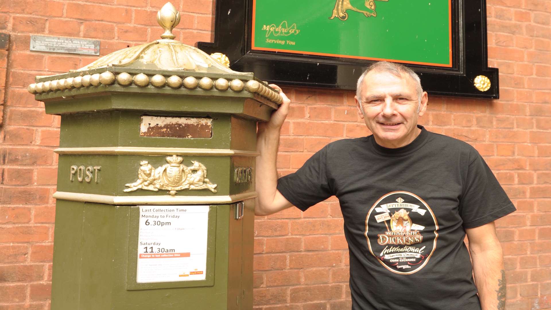 The Old Brewery, Victoria Street, Rochester. Signwriter Mick Pollard with his work.