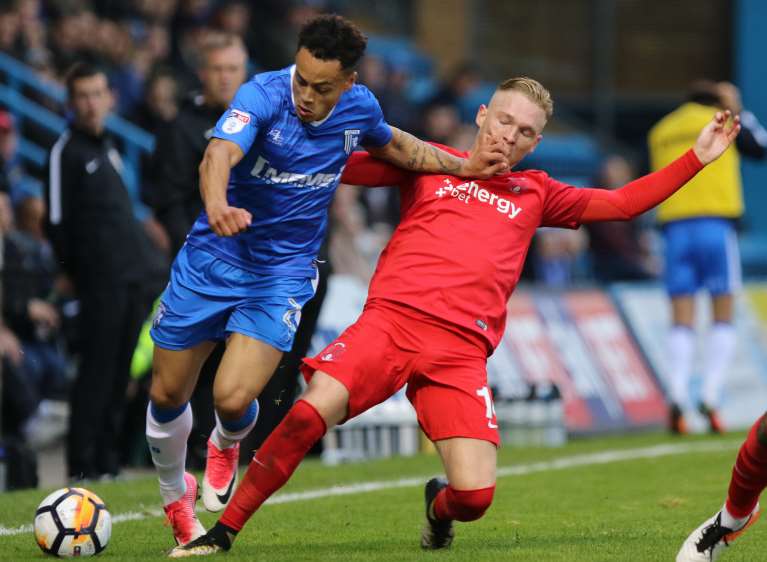 Gills' Elliott List takes on Leyton Orient's Myles Judd. Picture: Andy Jones