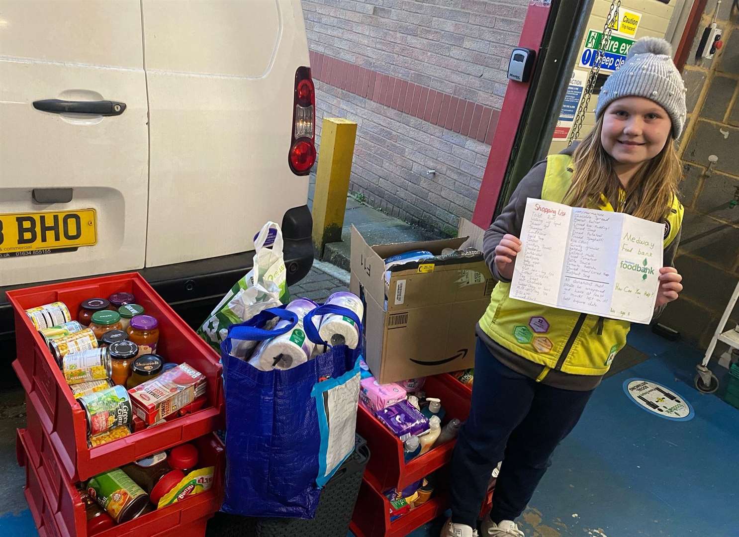 Rose from Twydall pictured with her nine crates of donations and her handmade leaflet about Medway Foodbank