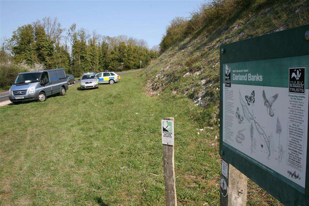 Police and undertakers on the scene after a body was found on Darland Banks