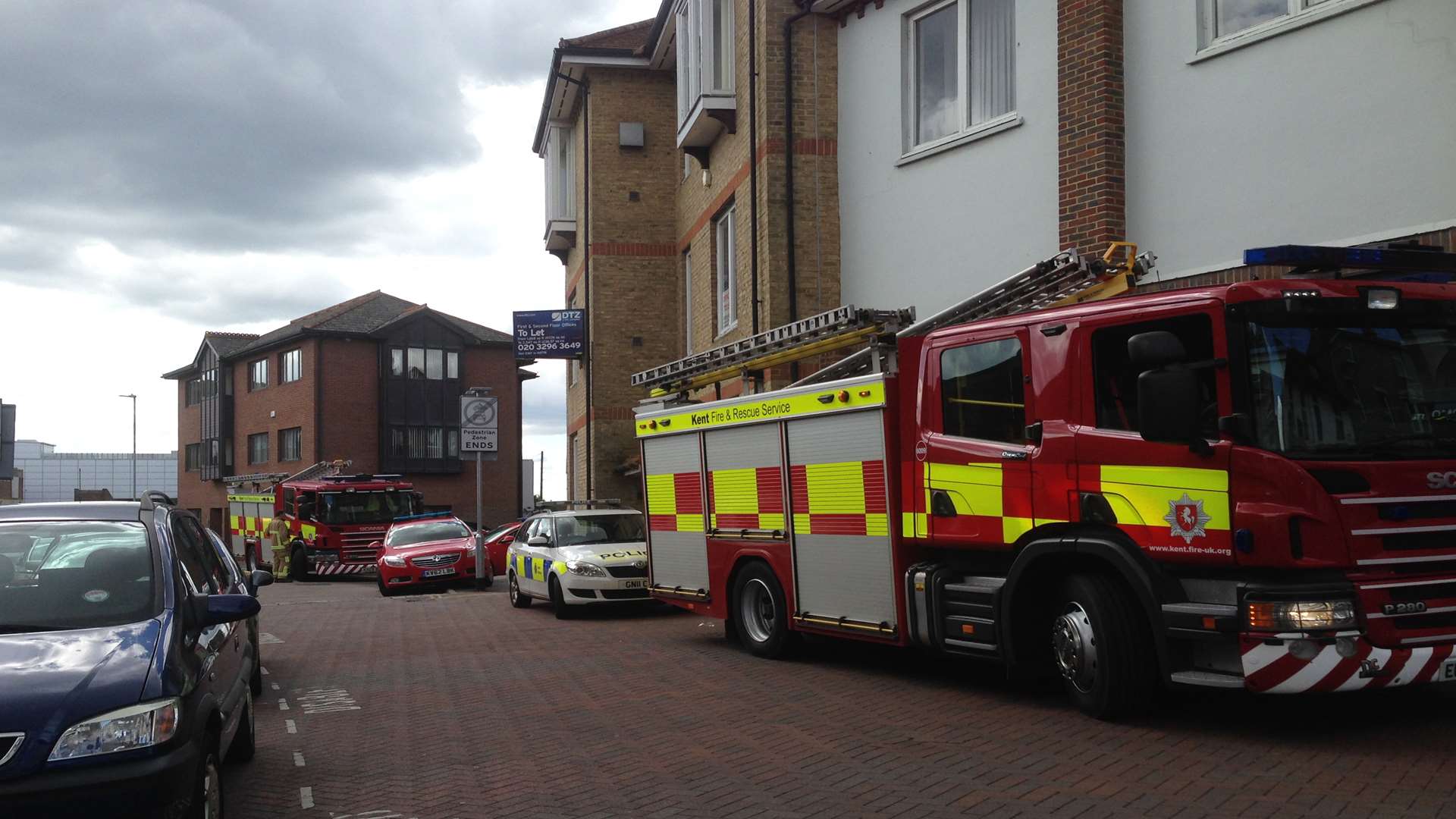 Firefighters and police near the New Street fire