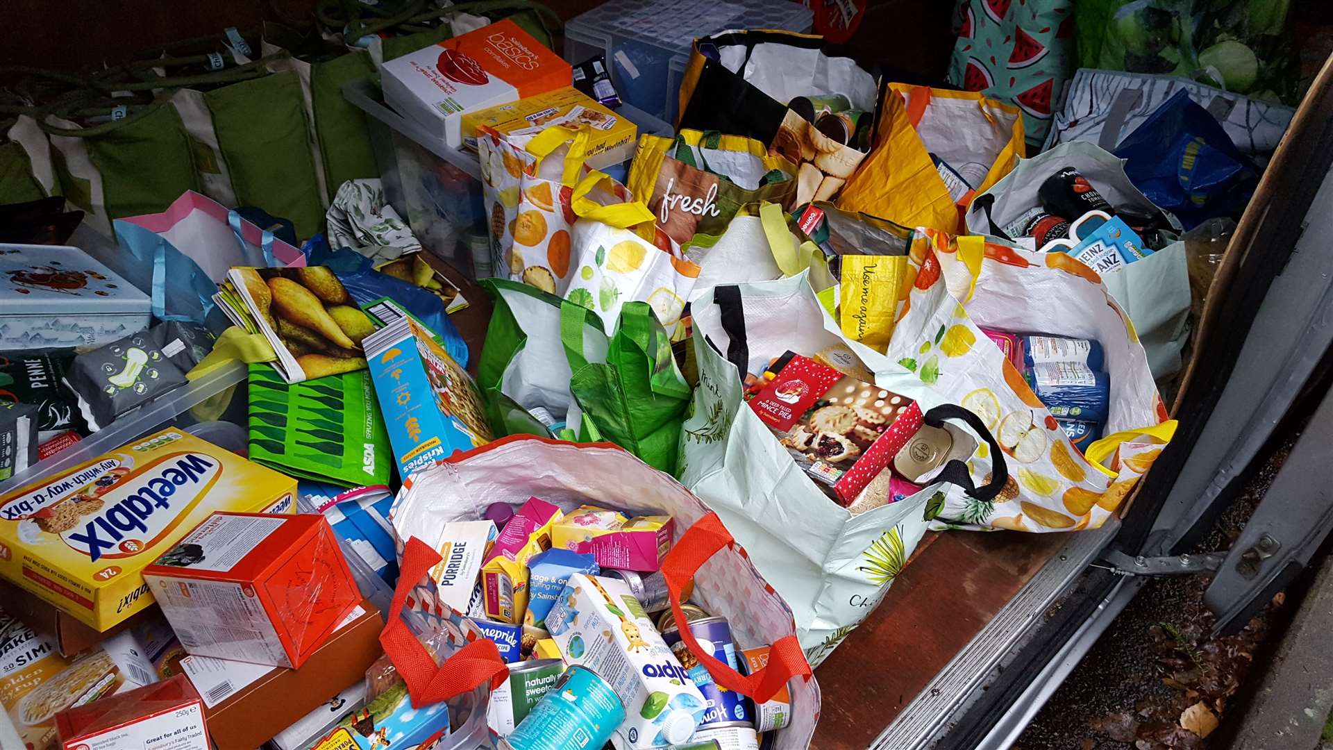 Donations of food waiting to be distributed at a food bank. Stock picture