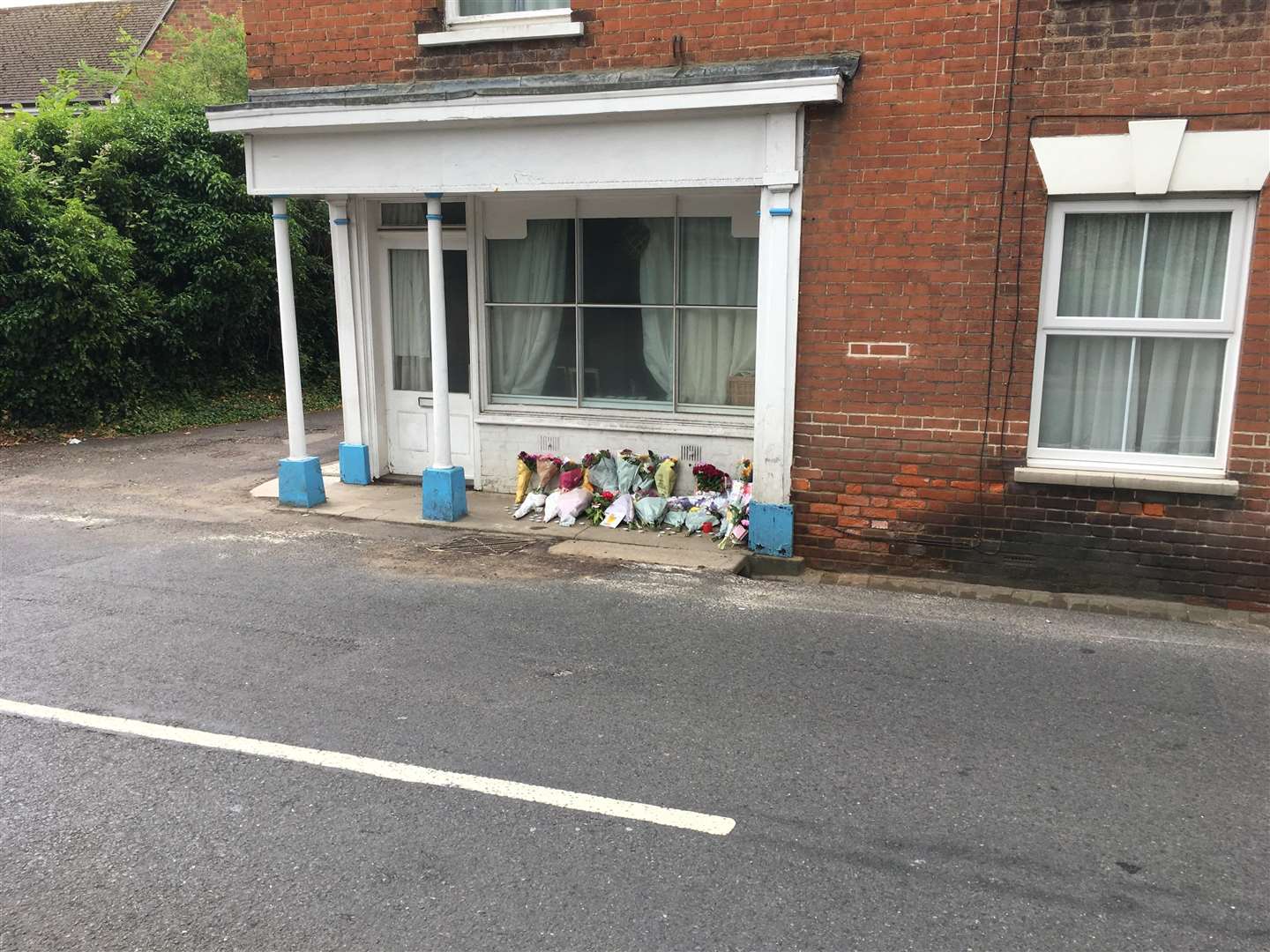 Floral tributes left at the crash scene in Wateringbury