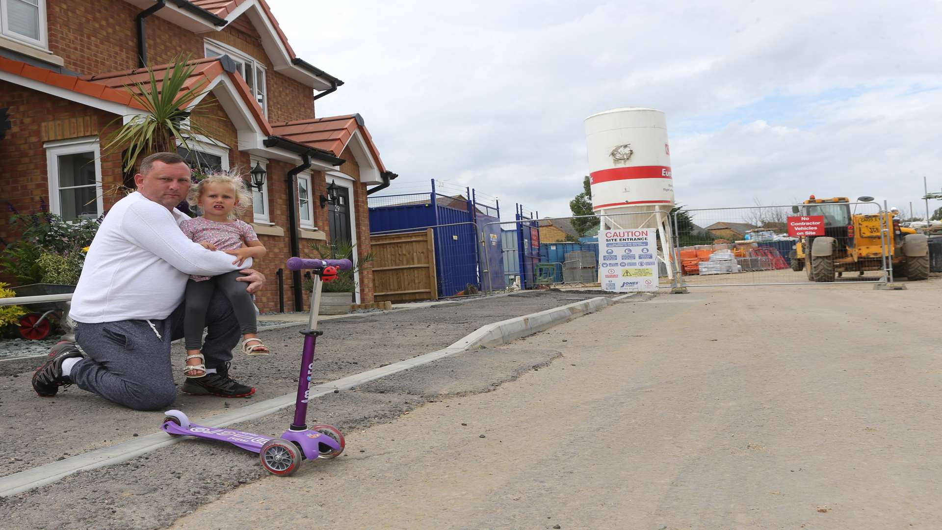 Tom Pexton with his daughter Lilly outside their new home. Picture: John Westhrop FM4834383