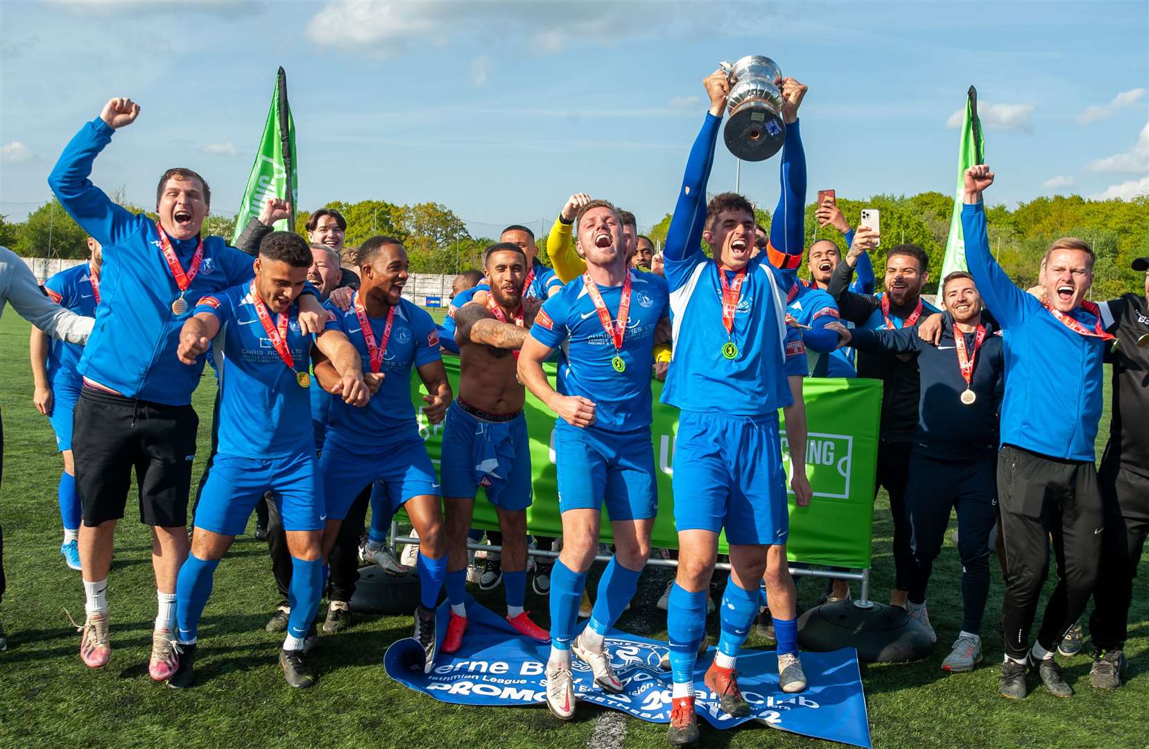 Herne Bay kit manager Aaron Smith, far left, in last season's promotion celebrations. Picture: Ian Scammell