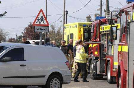 The scene in Bridgefield Road near the junction of Kemp Road as the emergency services deal with the trench collapse.