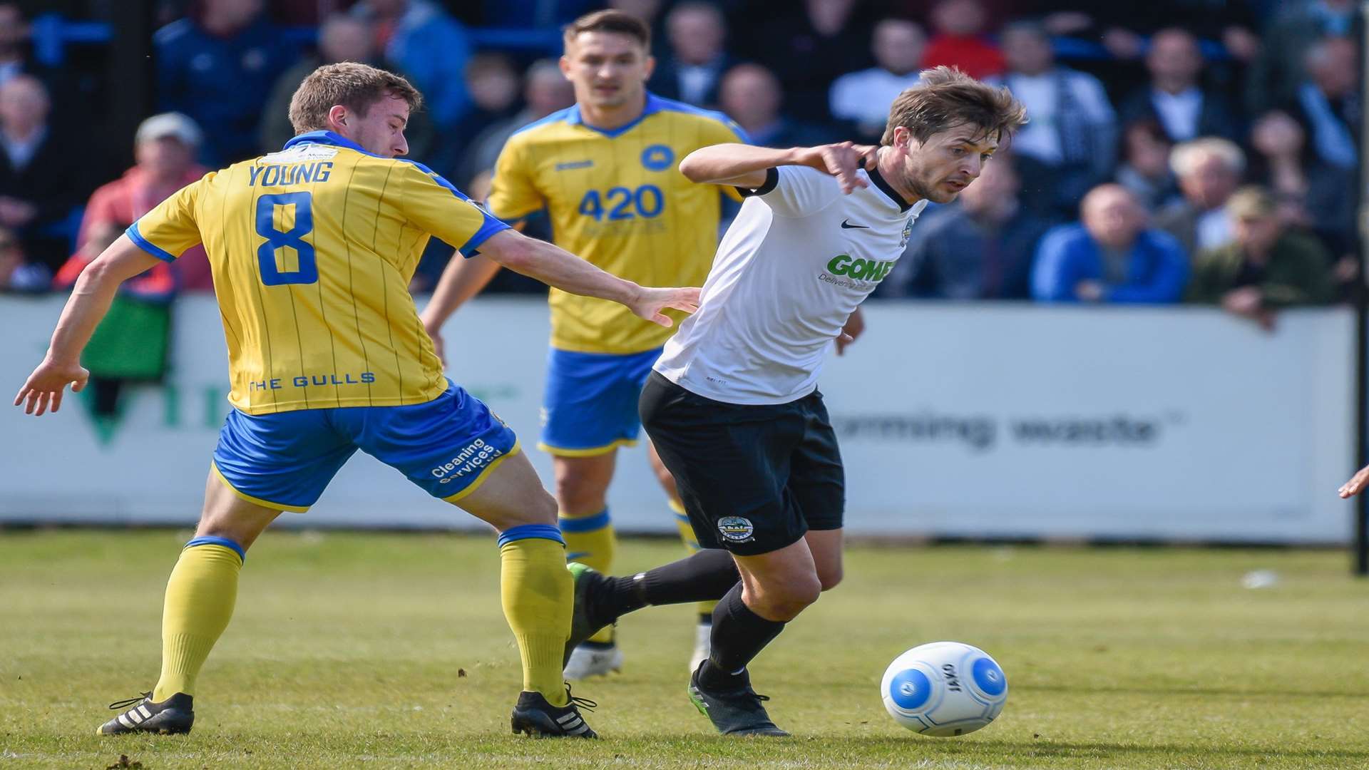 Joe Healy goes past Torquay's Luke Young Picture: Alan Langley