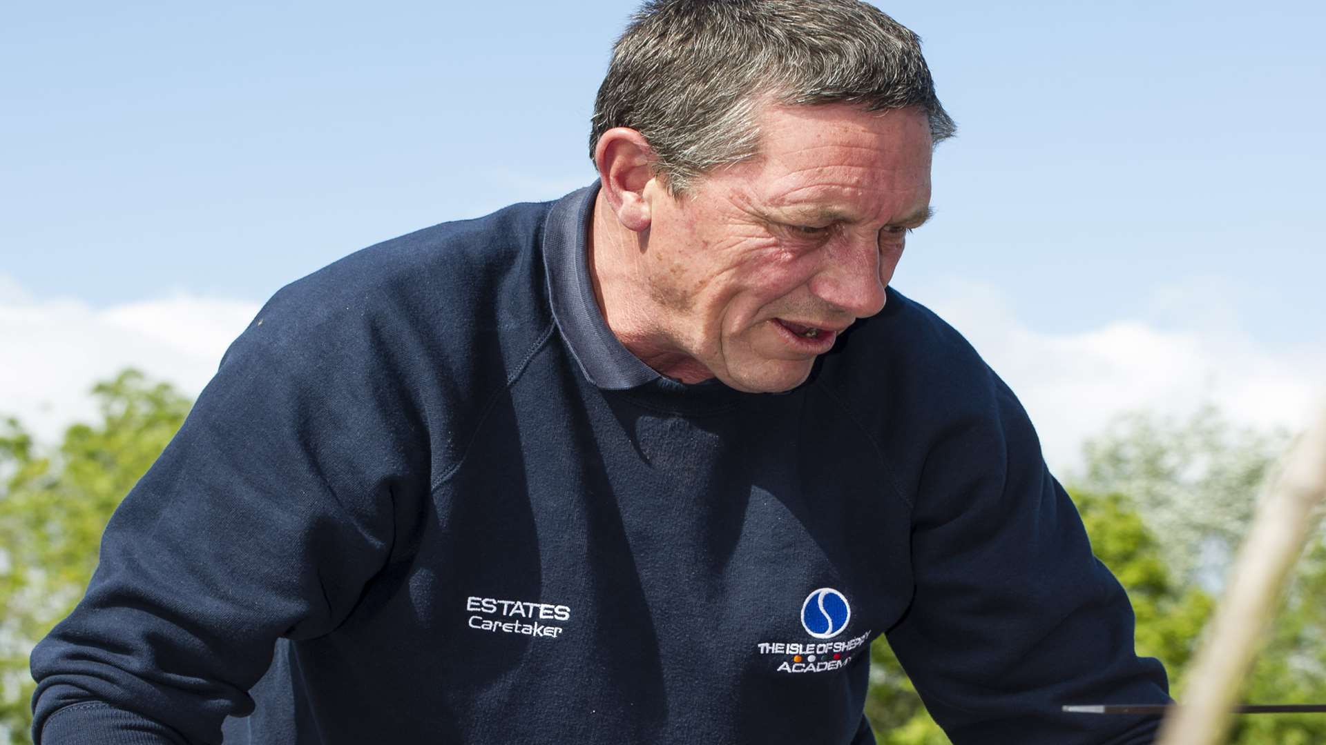 Staff member Paul Dixon helps out in the garden.