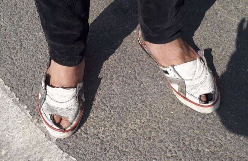 A migrant's battered shoes. Picture: Poppy Cleary