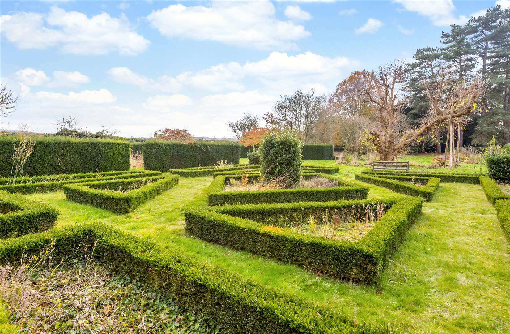 The property contains extensive manicured gardens and plants from Kew Gardens