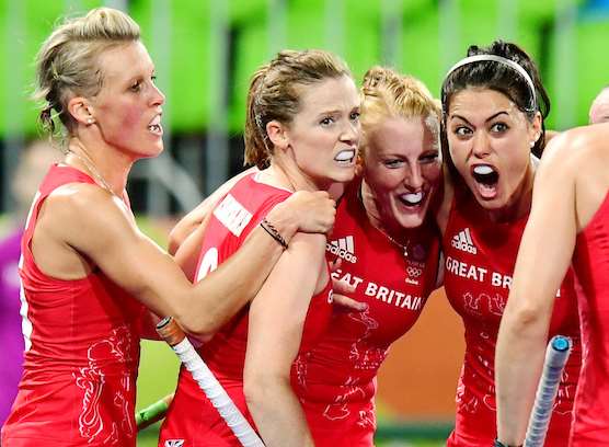 Nic White (centre) is mobbed after scoring, with Holcs teammate Sam Quek (right). Picture: Frank Uijlenbroek