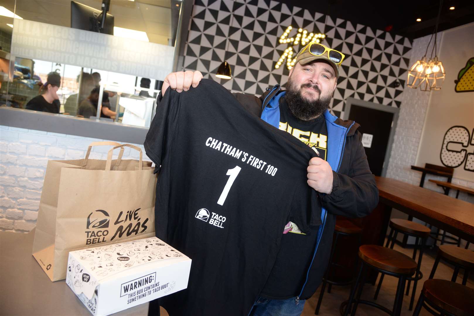 Lee Murphy from Chattenden was the first customer at the opening of the Taco Bell at The Quays, Dock Head Road, St Mary's Island, Chatham on Wednesday. Picture: Chris Davey..... (10357678)