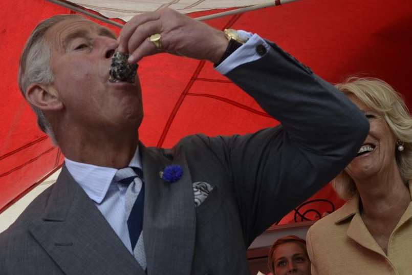 Down in one! Prince Charles eats an oyster in Whitstable. Picture: Gary Browne