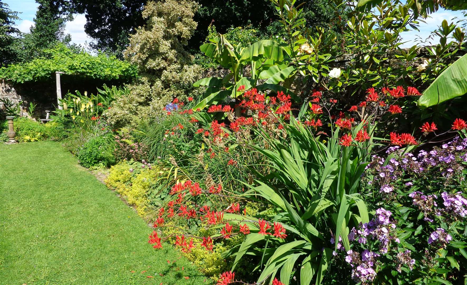 The garden at Goddards Green dates back to the 1920s, but the owners updated it in 1992. Picture: National Garden Scheme