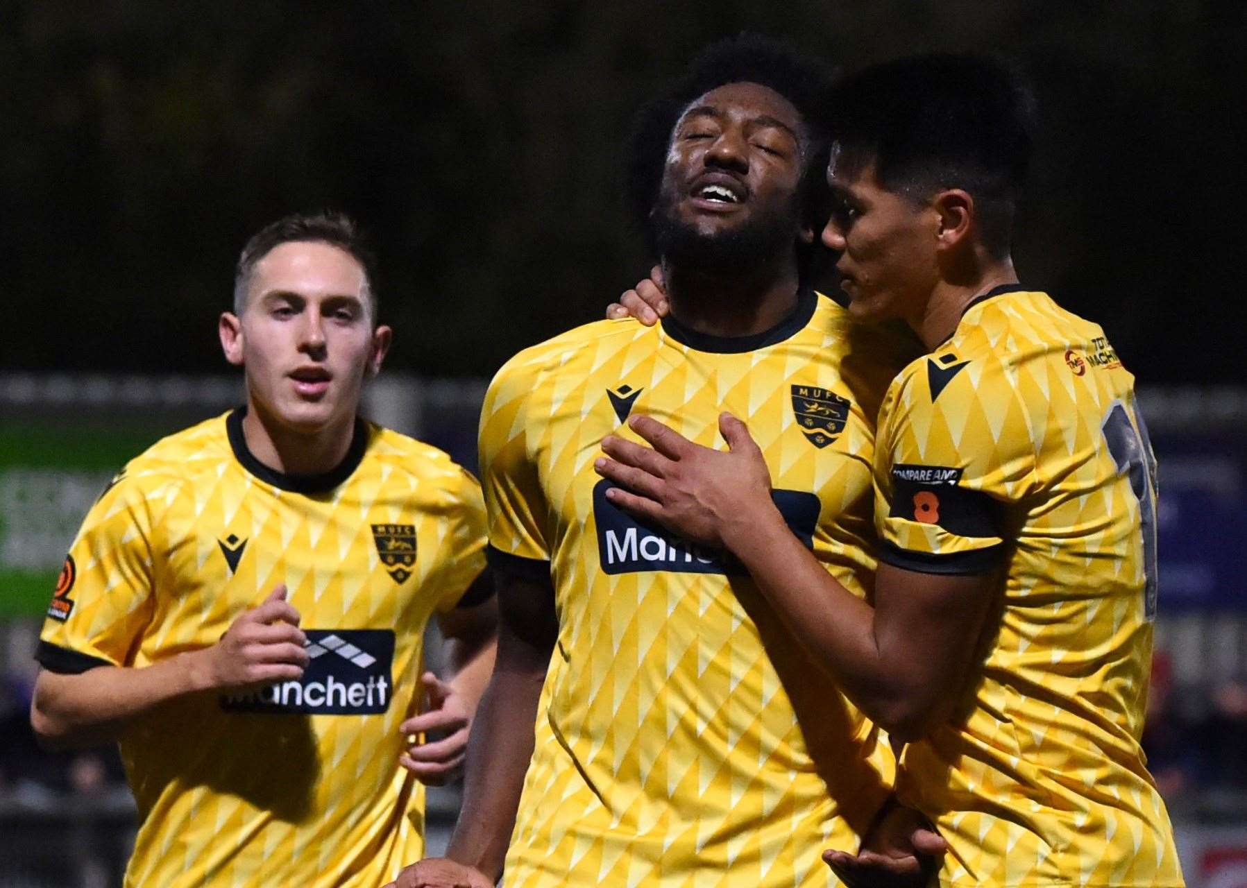 Devonte Aransiba, centre, celebrates his opener with Matt Rush and Bivesh Gurung. Picture: Steve Terrell